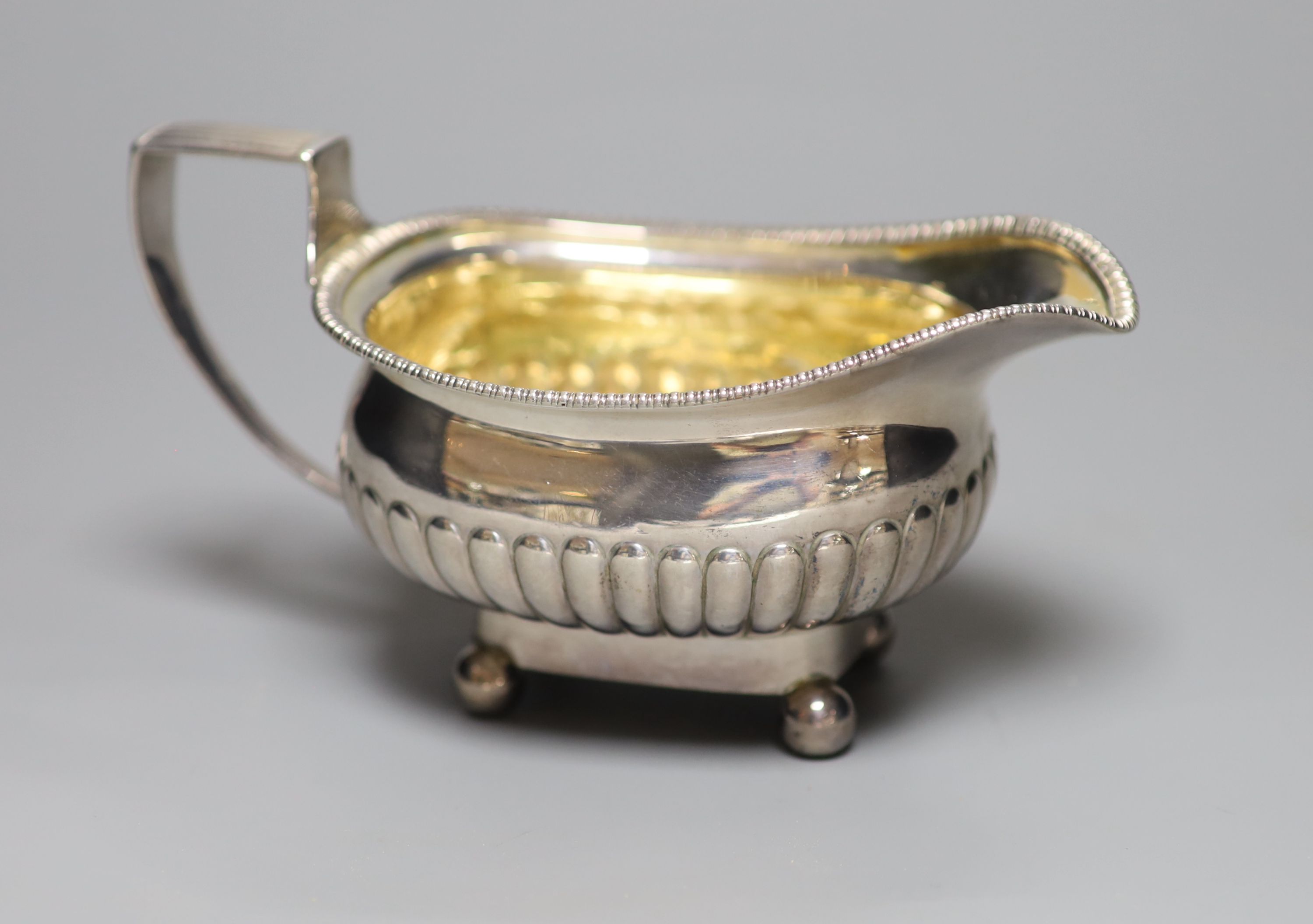 A William IV demi fluted silver cream jug, London, 1833